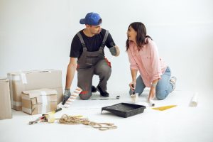A young couple is renovating an office (illustration)